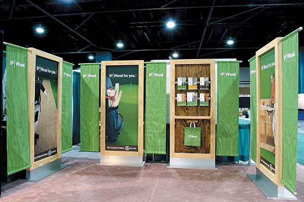 Wood-framed panel equipped with a handy shelf, wire baskets and hangers for holding sales literature, giveaway items and branded shopping bags.